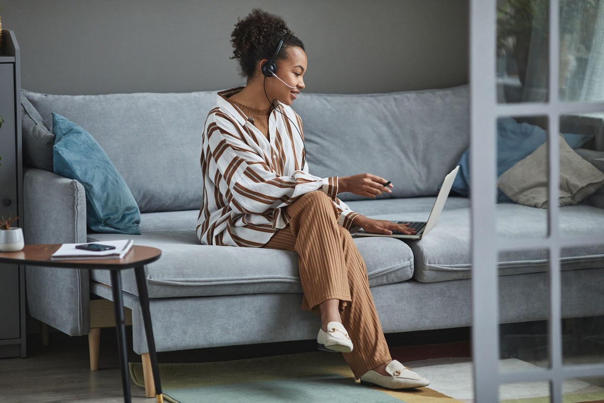Woman on a video call from her living room couch